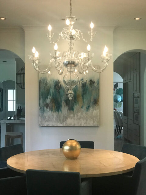 chandelier lighting above the table